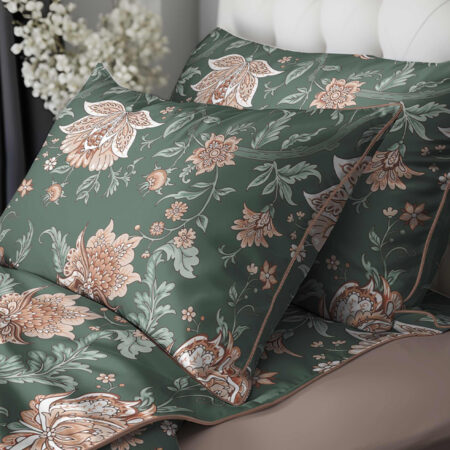 Green floral bedding set with large peach-and-cream flowers and leaves on pillowcases and sheets, a decorative bed setup.